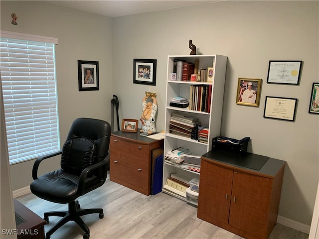 office space with light hardwood / wood-style floors