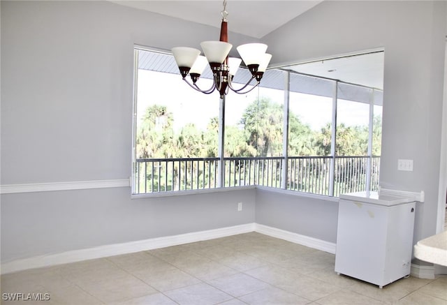 unfurnished dining area with light tile patterned flooring, a healthy amount of sunlight, and a chandelier