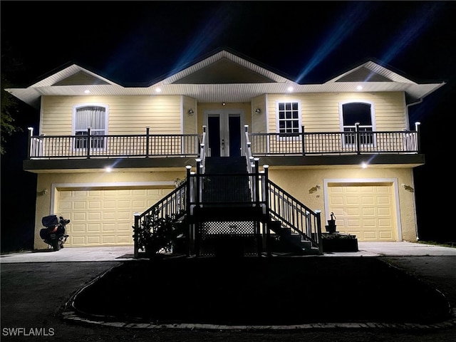 view of front facade featuring a garage and french doors