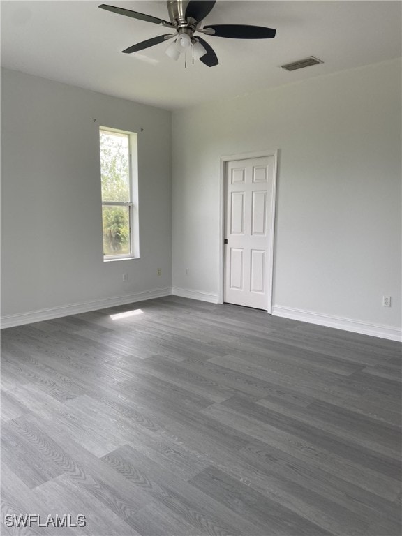 unfurnished room featuring ceiling fan and wood-type flooring