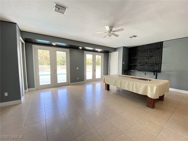 unfurnished bedroom with ceiling fan, french doors, access to outside, pool table, and light tile patterned floors