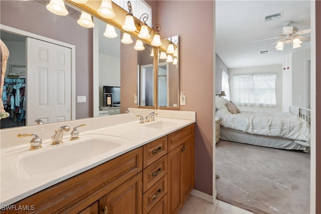 bathroom featuring vanity, tile patterned flooring, and ceiling fan