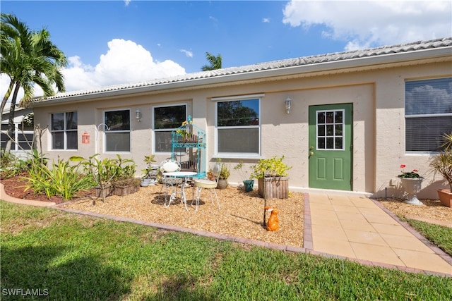 view of front of house with a patio area