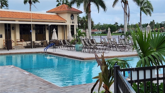 view of swimming pool with a patio