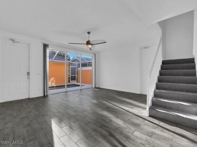 unfurnished living room featuring hardwood / wood-style floors and ceiling fan