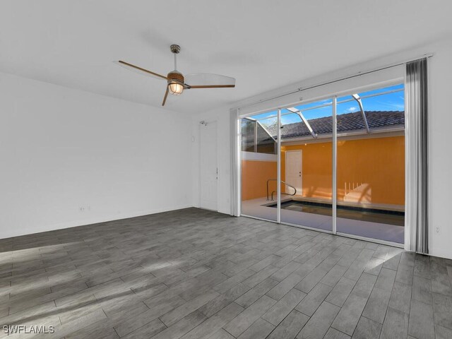 interior space with ceiling fan and wood-type flooring