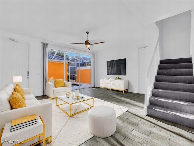 living room featuring ceiling fan and hardwood / wood-style floors