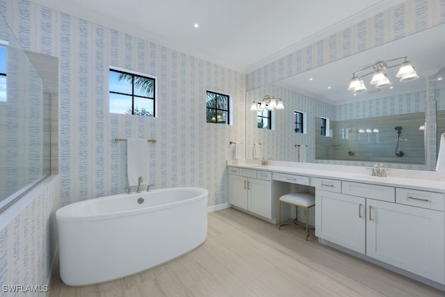 bathroom featuring vanity, crown molding, and shower with separate bathtub