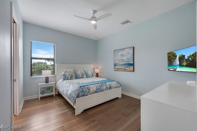 bedroom with ceiling fan and wood-type flooring