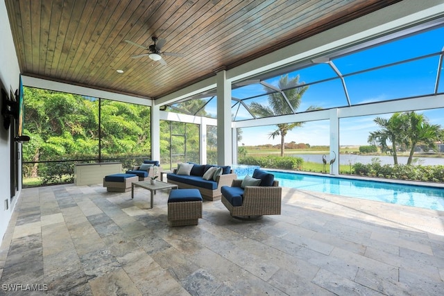 exterior space featuring an outdoor hangout area, a water view, a lanai, a patio, and ceiling fan