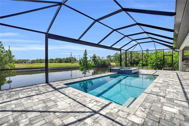 view of pool with a water view, a patio, an in ground hot tub, and glass enclosure