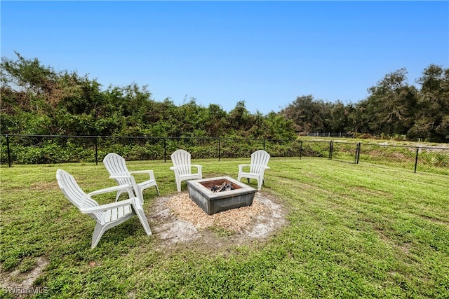 view of yard with a fire pit