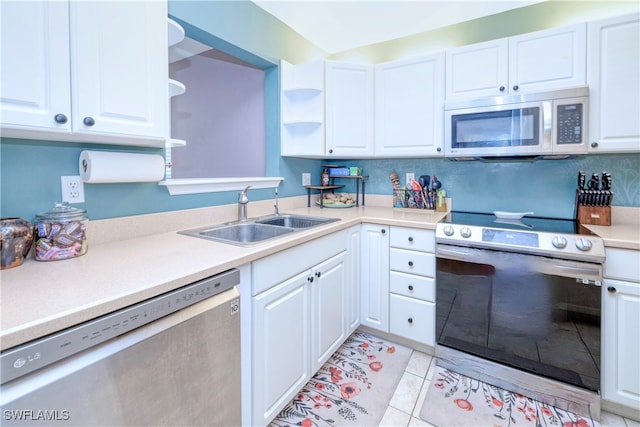 kitchen featuring sink, white cabinetry, and stainless steel appliances