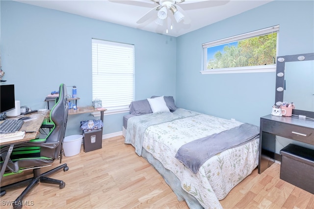 bedroom featuring light hardwood / wood-style floors and ceiling fan