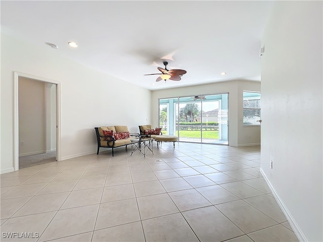 unfurnished room featuring light tile patterned flooring and ceiling fan