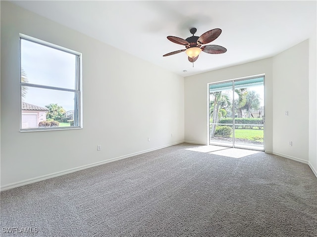 unfurnished room with carpet and ceiling fan