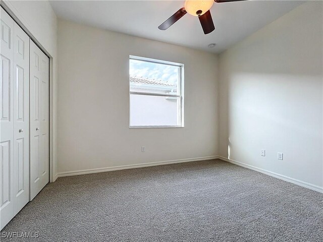 3452 Via Montana Way N, Fort Myers, FL 33917 - unfurnished bedroom with baseboards, carpet floors, a ceiling fan, and a closet