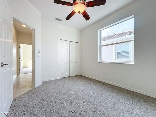 3452 Via Montana Way N, Fort Myers, FL 33917 - unfurnished bedroom featuring baseboards, visible vents, light colored carpet, a ceiling fan, and a closet