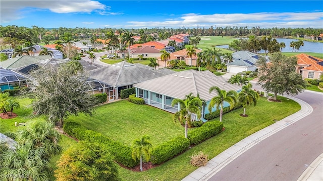 birds eye view of property with a water view