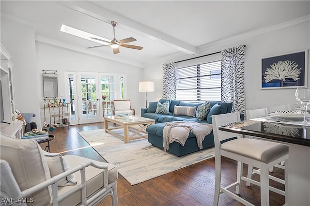 living room with crown molding, ceiling fan, vaulted ceiling with beams, and dark hardwood / wood-style floors