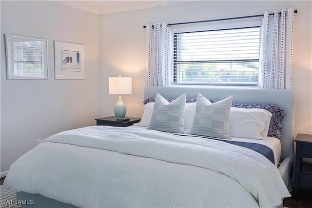 bedroom with crown molding