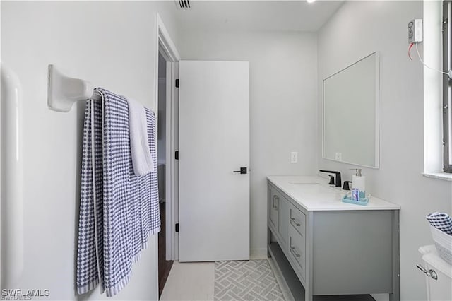 bathroom featuring tile patterned flooring and vanity