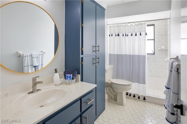 bathroom featuring toilet, tile patterned flooring, walk in shower, and vanity