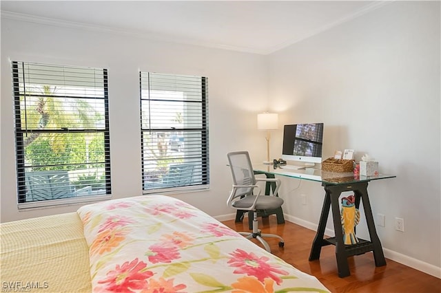 bedroom featuring hardwood / wood-style floors and crown molding