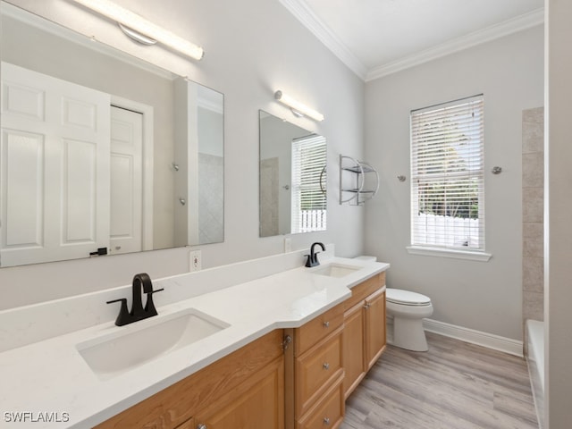 bathroom with hardwood / wood-style flooring, vanity, toilet, and a shower