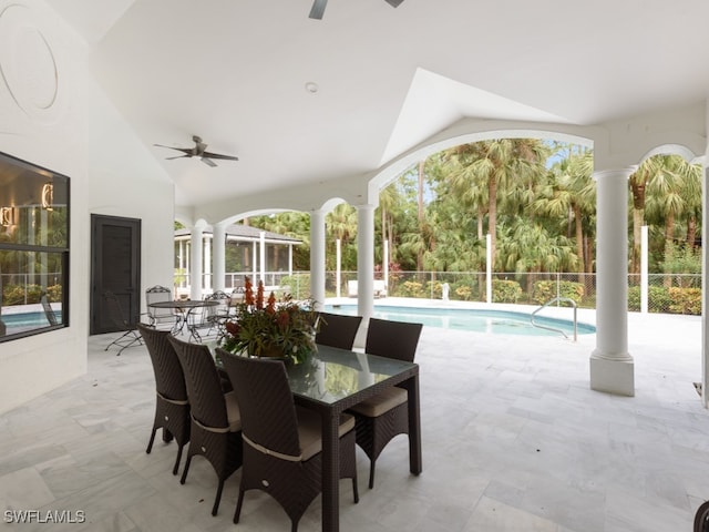 view of patio with a fenced in pool and ceiling fan