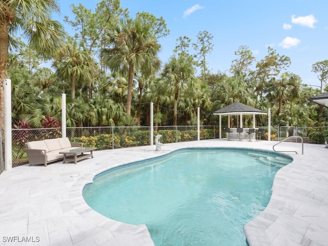 view of swimming pool with a gazebo and a patio area