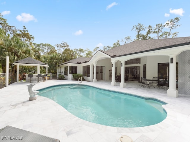 view of swimming pool featuring a gazebo and a patio