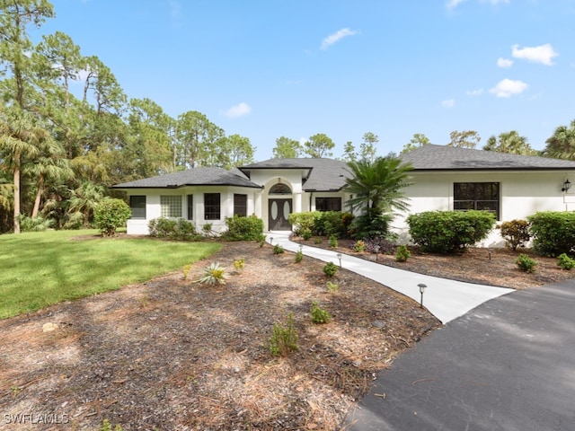 view of front of home with a front lawn