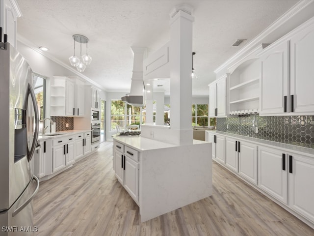 kitchen with stainless steel appliances and white cabinets