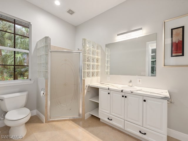 bathroom with an enclosed shower, tile patterned floors, vanity, and toilet