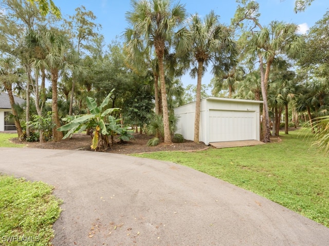 view of yard with a garage