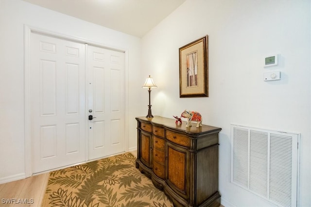 entrance foyer featuring hardwood / wood-style flooring