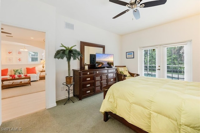 bedroom with ceiling fan, light colored carpet, french doors, and access to outside