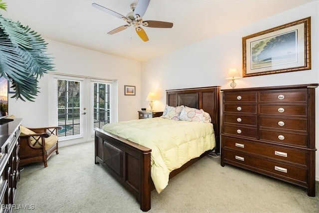 carpeted bedroom with access to outside, french doors, and ceiling fan