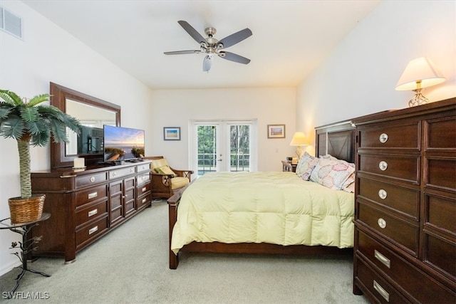 bedroom featuring access to exterior, ceiling fan, light carpet, and french doors