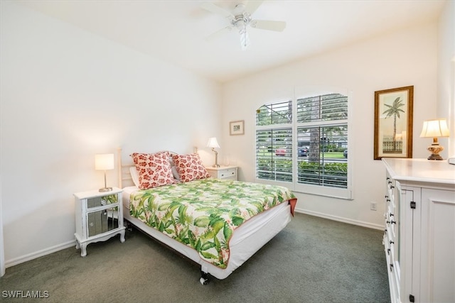 bedroom with ceiling fan and dark carpet