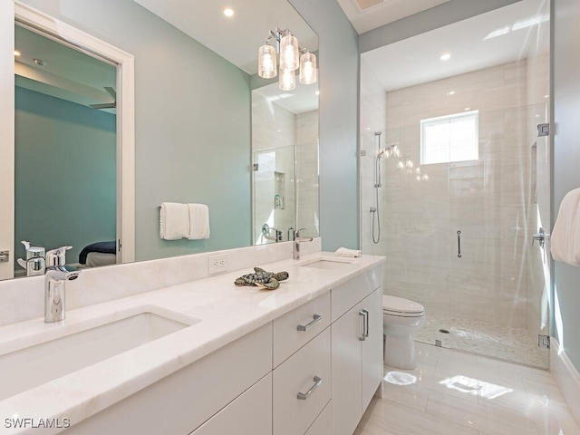 bathroom featuring vanity, toilet, and walk in shower