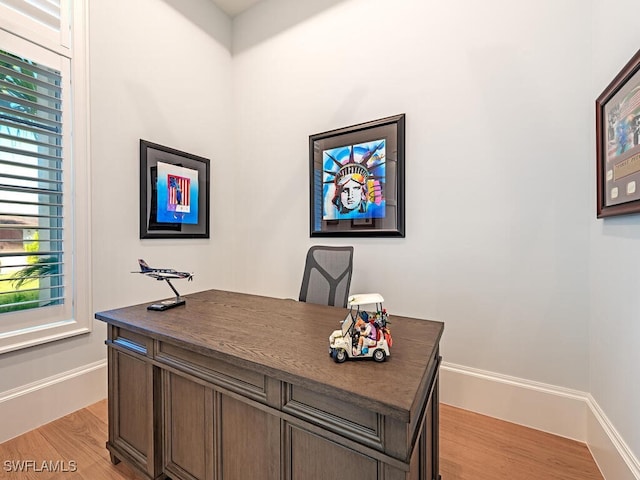 office space with light hardwood / wood-style floors