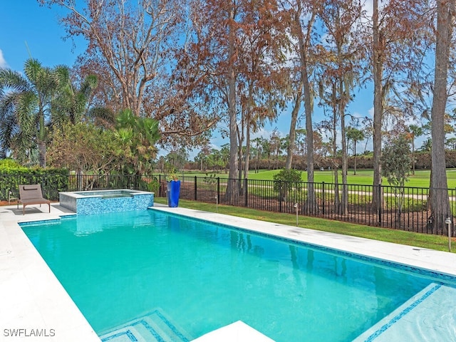 view of pool with a yard and an in ground hot tub