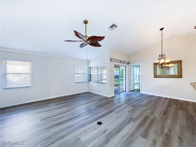 unfurnished living room with crown molding, ceiling fan with notable chandelier, vaulted ceiling, and dark hardwood / wood-style flooring