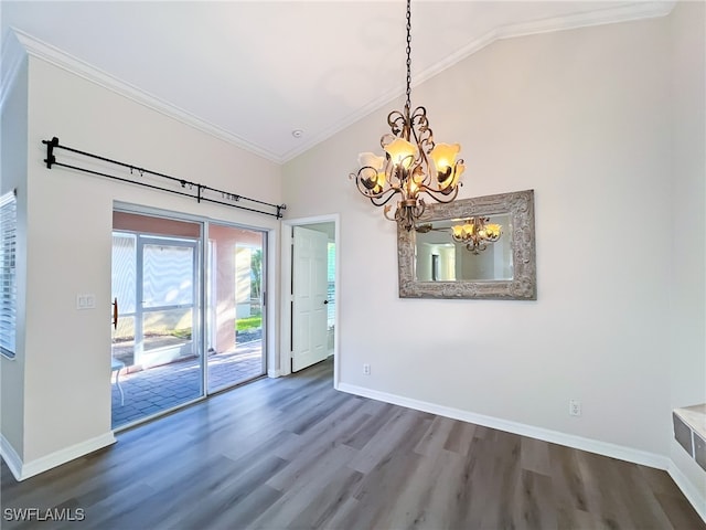 empty room with lofted ceiling, dark hardwood / wood-style flooring, ornamental molding, and a chandelier