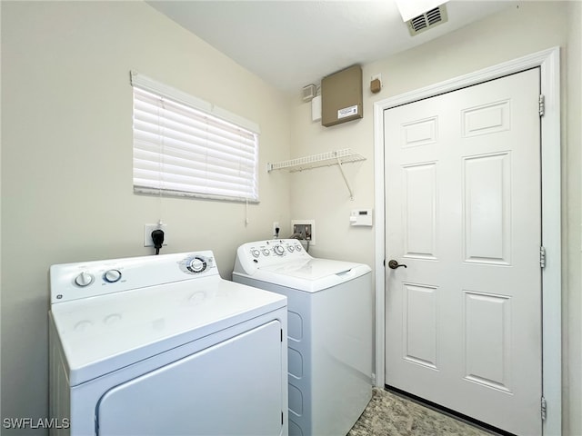 washroom with washing machine and dryer