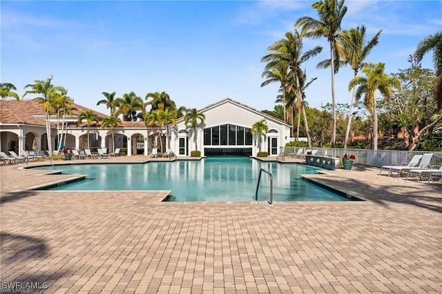 view of swimming pool featuring a patio area