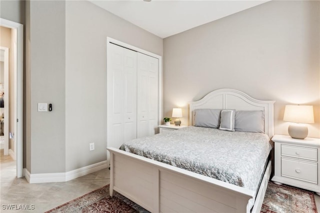 tiled bedroom with a closet