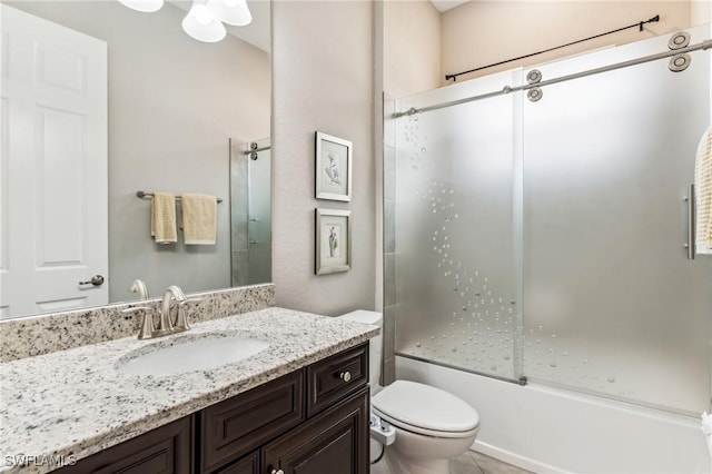 full bathroom featuring vanity, toilet, and enclosed tub / shower combo